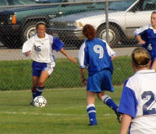 Joanna staying with the soccer ball